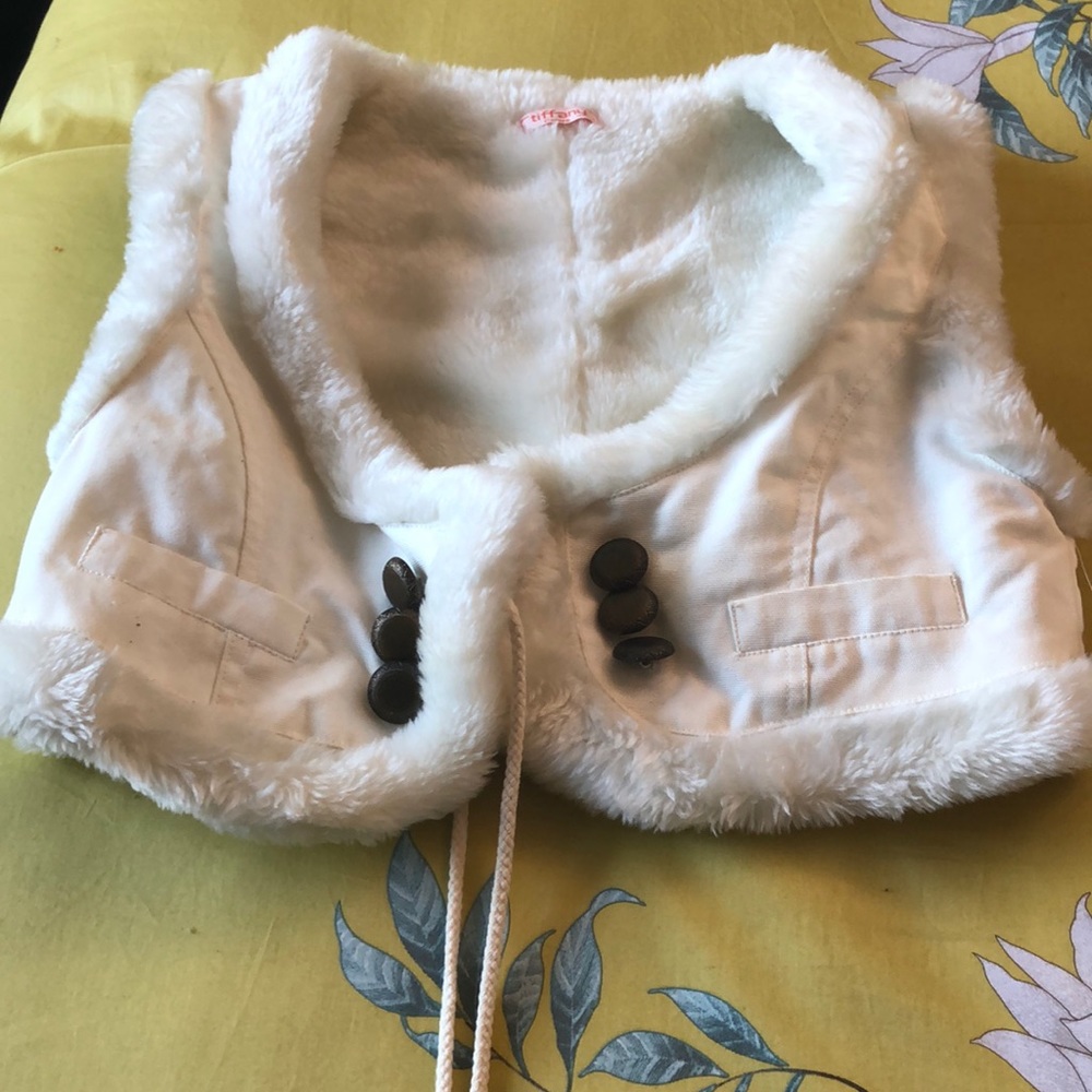 Tiffany fluffy white vest.